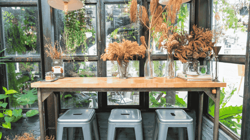 Balcony with artificial plants to inspire outdoor decor ideas.